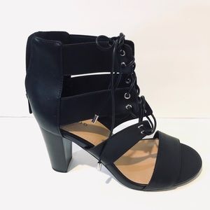 New in box Torrid Black Heels caged size 9.5 wide